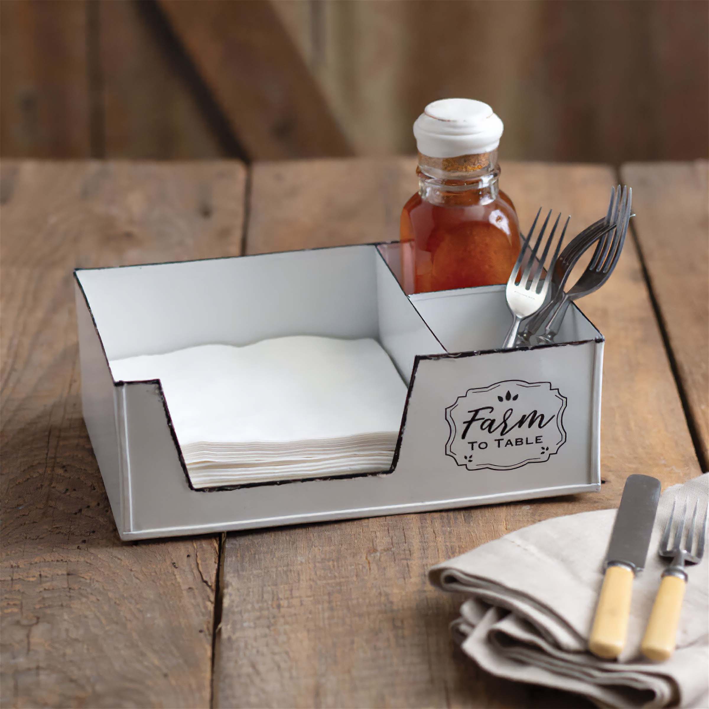 Vintage kitchen storage caddy holding napkins and utensils with a 'Farm to Table' design, perfect for organized rustic kitchen decor.