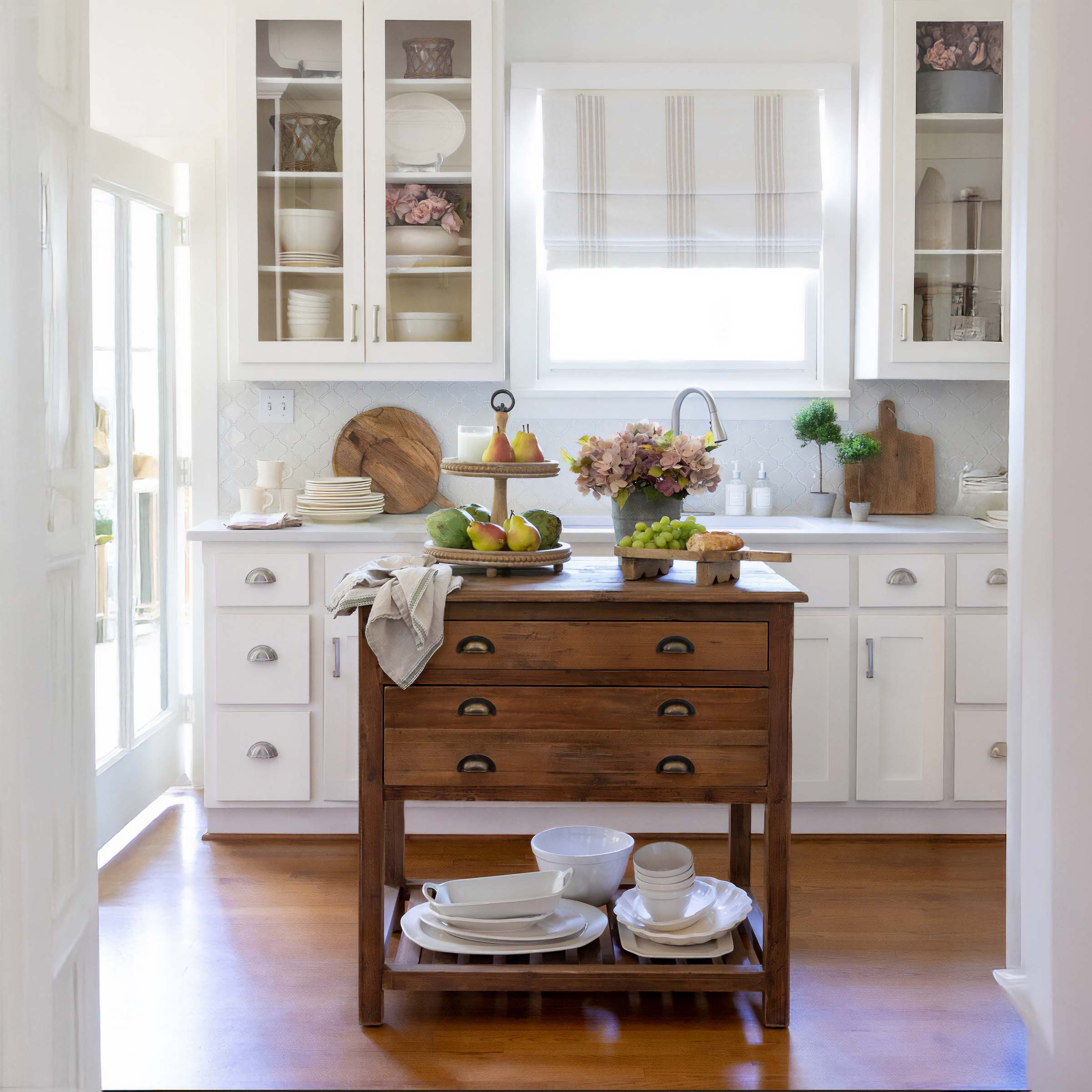 Vintage kitchen decor with white cabinets, wooden island, and nostalgic accents offering a charming and nostalgic cooking space.