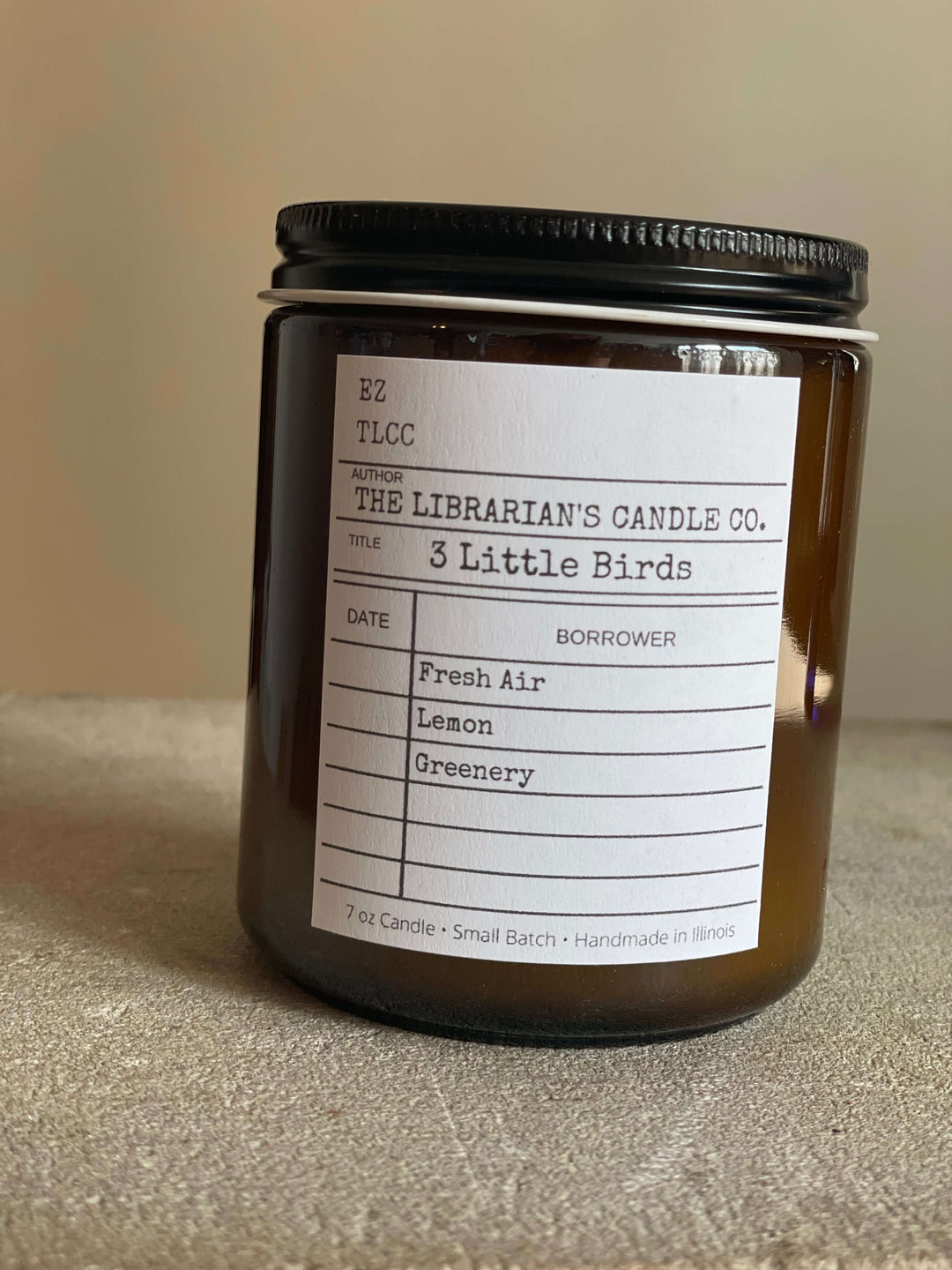 3 Little Birds Scented Candle: Fresh Air, Lemon & Greenery in apothecary jar with label, home decor, soothing aroma.