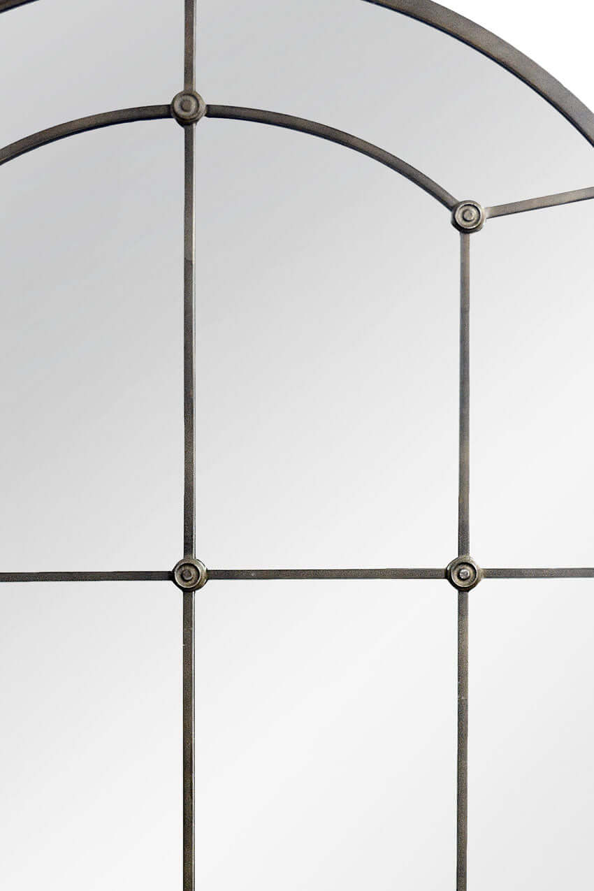 Arched Industrial Grid Wall Mirror featuring a vintage-inspired black metal frame with a windowpane design.