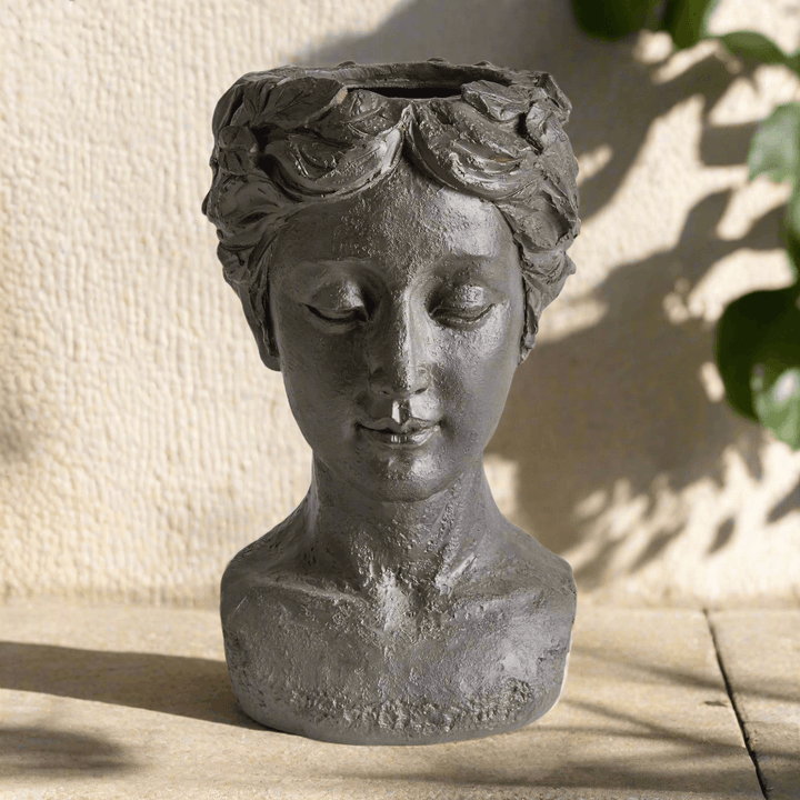 Athena bust planter on patio outdoors