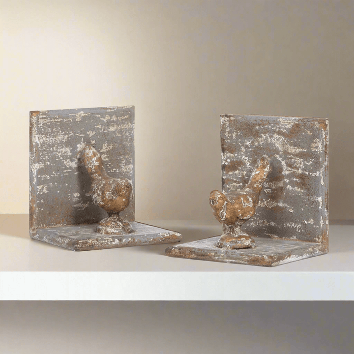 Vintage metal bird bookends with rustic finish, crafted from solid iron and gilded accents, evoking a poetic vintage aura.