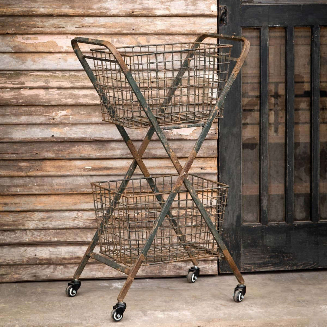 Vintage rolling metal market cart with double baskets, farmhouse style, weathered metal finish, adds rustic charm.