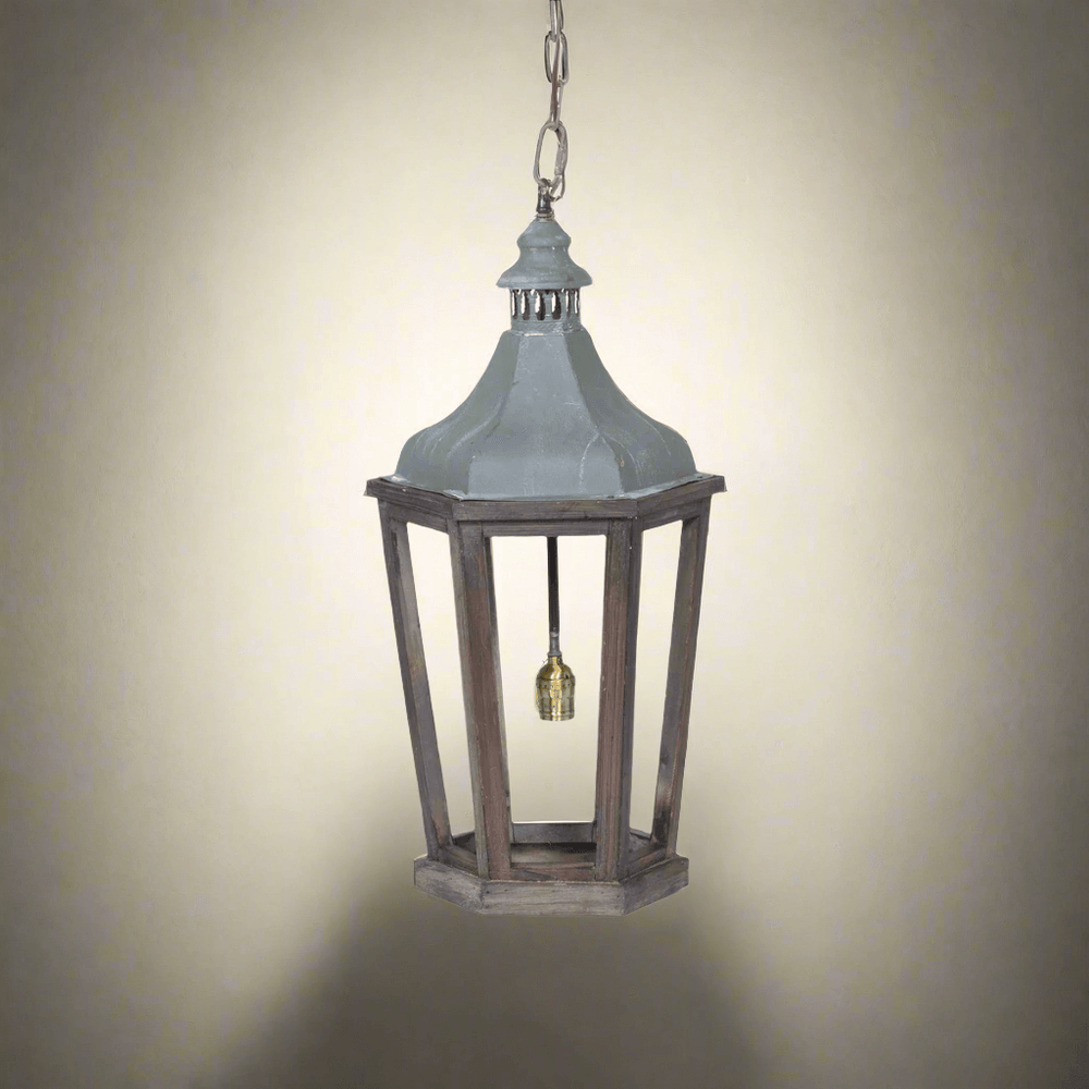 Decorative hanging lantern with a rustic design on a neutral background