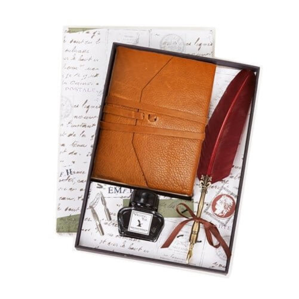 Brown leather notebook with a red feather quill pen and ink bottle on a decorative box.