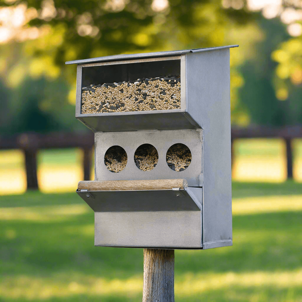 Rustic farmhouse bird feeder crafted from galvanized metal, designed for multiple birds and outdoor charm.