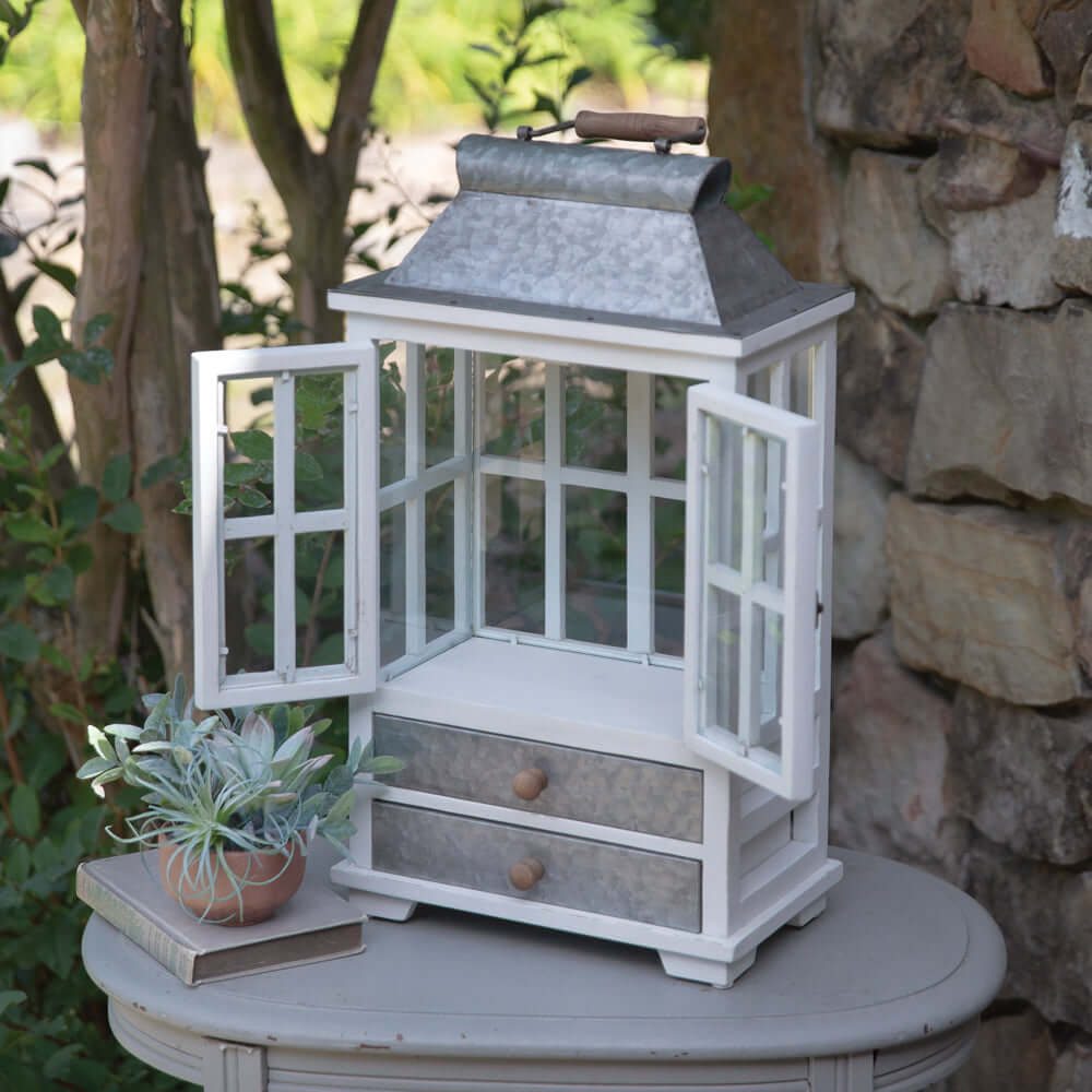 Rustic farmhouse greenhouse lantern with drawers, whitewashed wood and galvanized metal, perfect for décor.