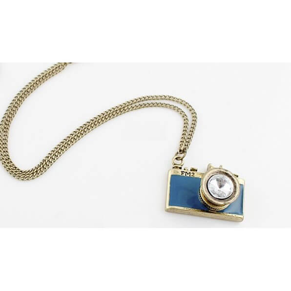 Vintage Camera Pendant Necklace with antique brass finish, teal enamel body, and crystal lens, capturing old-world charm and nostalgia.