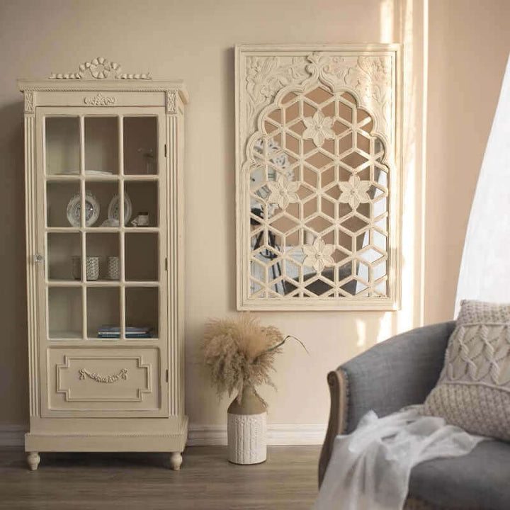 Vintage Floral Lattice Wall Mirror displayed beside a beige glass cabinet in a softly lit, elegant living space.