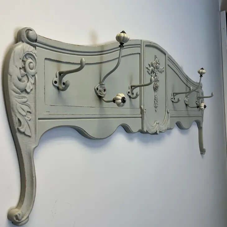 Vintage French country wall-mounted coat rack with ornate carvings and distressed finish, perfect for shabby chic decor.