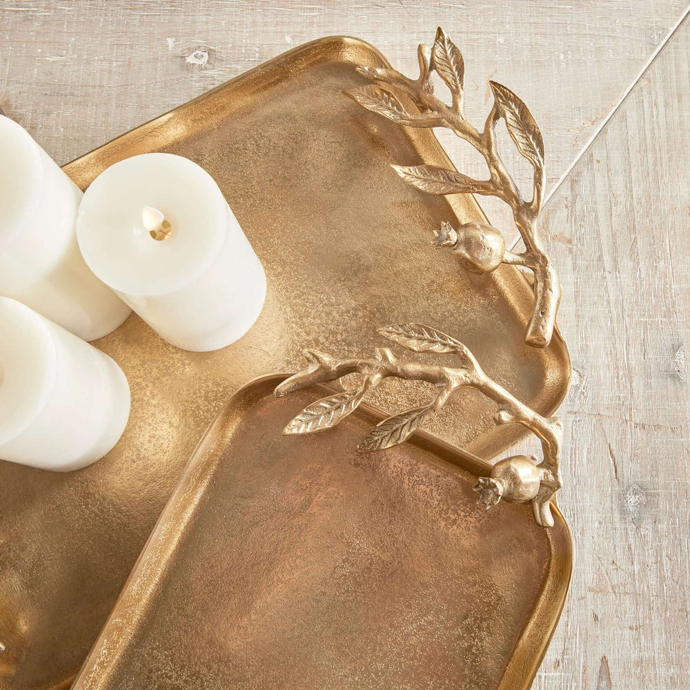 Antique gold decorative trays with pomegranate handles, featuring elegant design and soft finish.