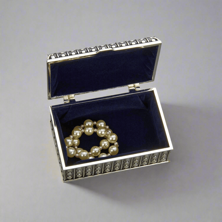 Antique-Style Silver Jewelry Box with beaded pearls inside, open with ornate detailing and vintage charm.