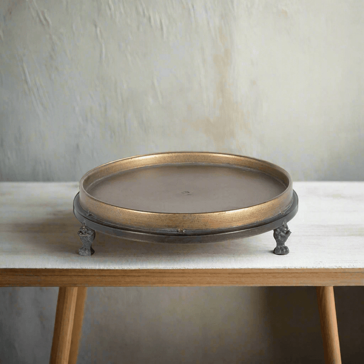 Antique Brass Footed Display Trays (Set of 2) on wooden table, showcasing elegant craftsmanship and vintage appeal.