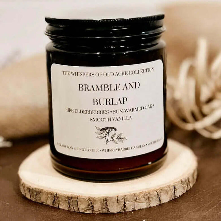 Bramble and Burlap Scented Candle: Elderberry, Oak & Vanilla in jar, rustic decor style, evokes summer countryside essence.