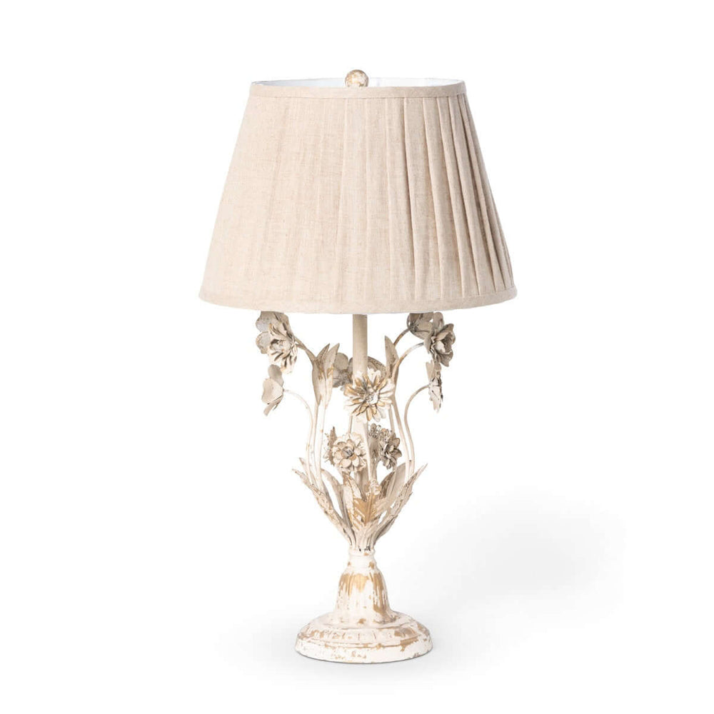 Cottagecore table lamp with vintage floral details; distressed antique white with delicate flower motifs, exuding romantic countryside charm.