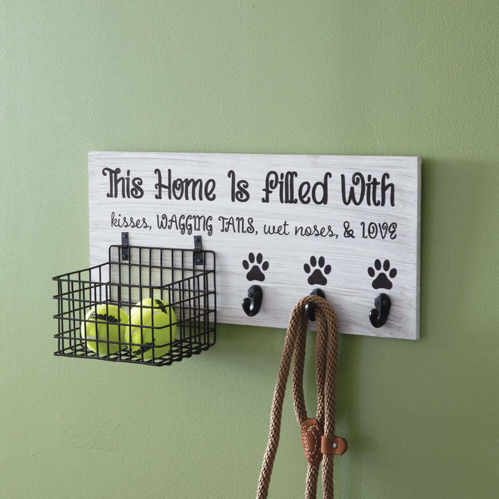 Wall-mounted Dog Leash Organizer with Hooks and Basket holding leashes and a basket storing tennis balls for pet convenience.