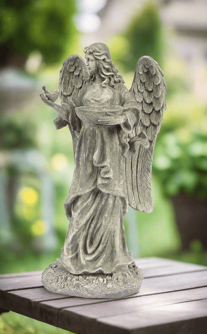 Garden Angel Statue Bird Feeder on table outdoors