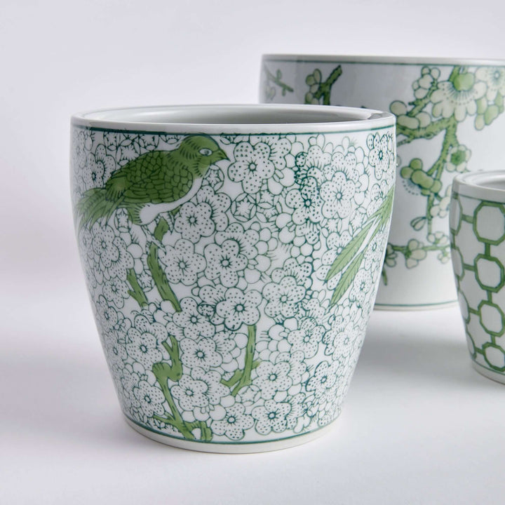 Elegant green and white chinoiserie ceramic planter featuring floral patterns and a bird design.