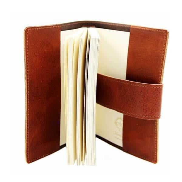 Open Handcrafted Italian Calfskin Leather Journal with red-brown leather and cream pages, showcasing fine Italian craftsmanship.