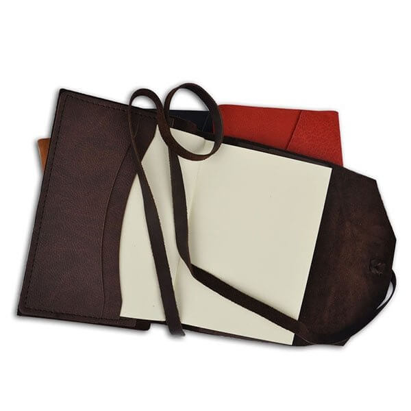 Handcrafted Italian Leather Wrap Journal with open pages and wrap strap on display