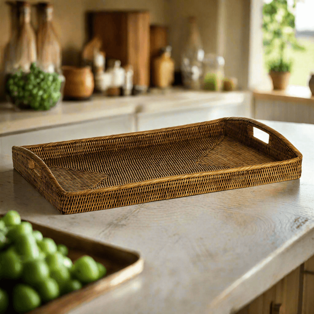 Rattan serving tray with handles in brown on a kitchen counter, ideal for vintage-inspired decor and everyday use.