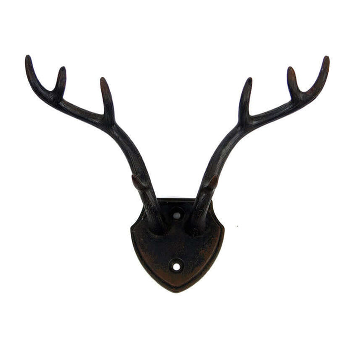 Rustic antler wall hook with shield backplate, ideal for lodge decor and rustic charm accents.