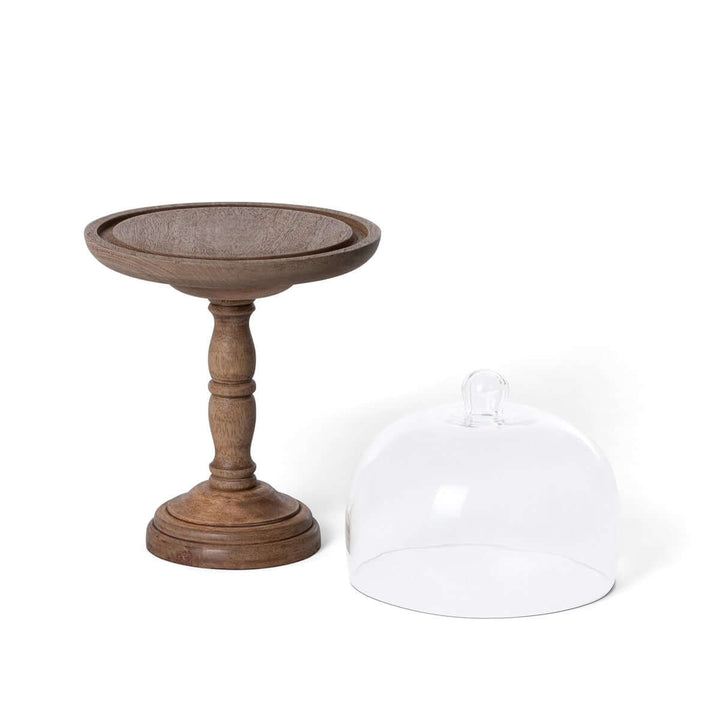 Tall rustic wood cake stand with glass dome, featuring carved pedestal and natural grain, ideal for stylish dessert presentation.