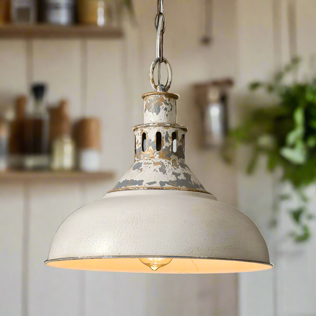 Vintage farmhouse metal pendant light with distressed white shade and galvanized accents, ideal for kitchen decor.