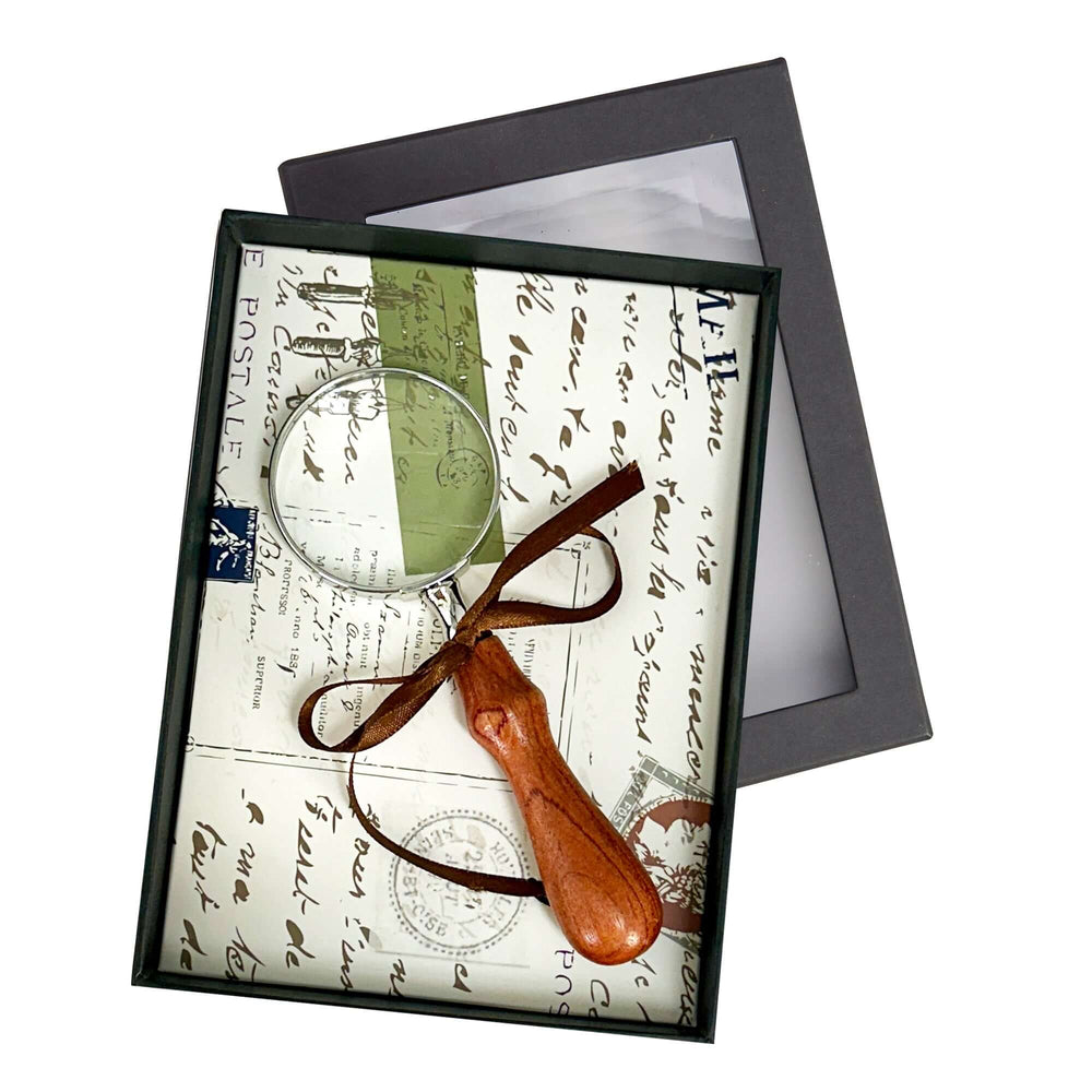 Vintage Handheld Magnifier with Wood Handle displayed in gift box with decorative background