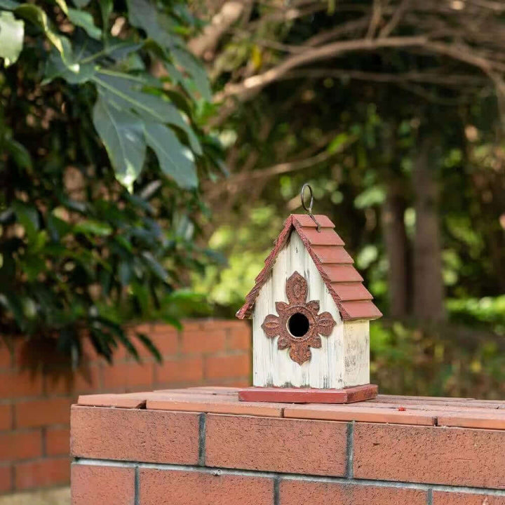 Vintage-Inspired Wooden Birdhouse with Terracotta Roof on brick wall in garden setting