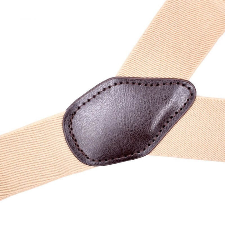 Close-up of Vintage Inspired Suspenders with Leather Button Tabs in beige with a brown leather connector.
