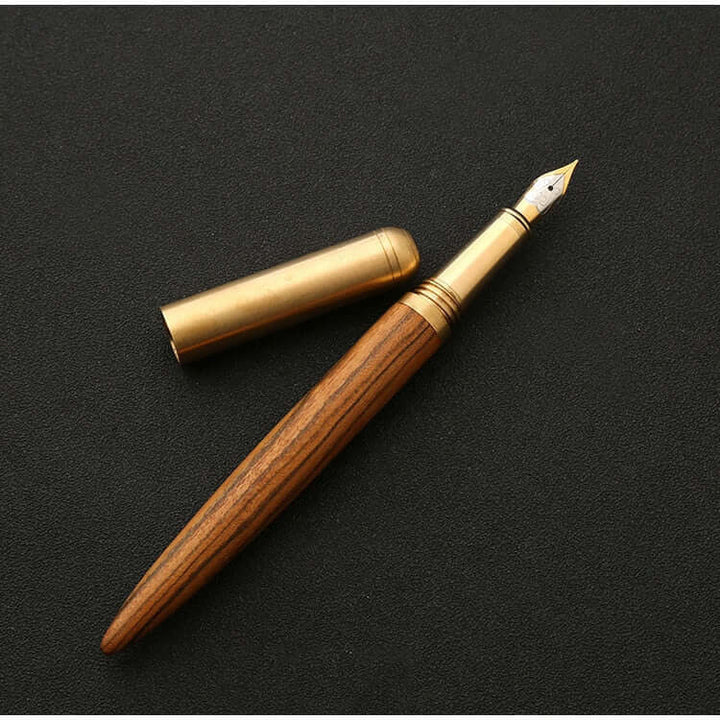 Vintage Wood and Brass Fountain Pen | The Hemmingway with cap, elegant craftsmanship on black background.