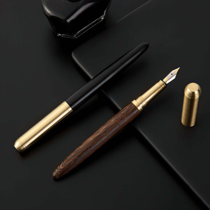 Vintage Wood and Brass Fountain Pen | The Hemmingway on a desk, showcasing elegant craft and timeless design.