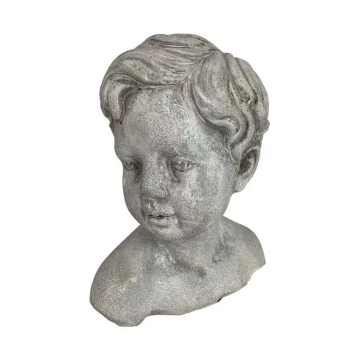 Vintage cement boy bust garden statue with detailed features and curls.