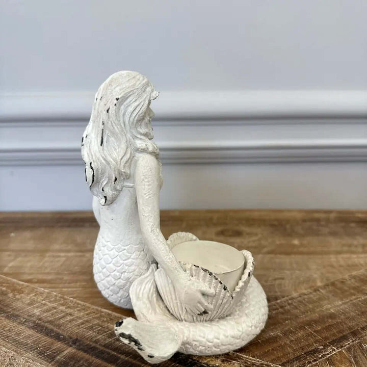 Vintage Coastal White Mermaid Candle Holder with distressed finish and seashell holder, evoking seaside charm and romance, perfect for tealights.