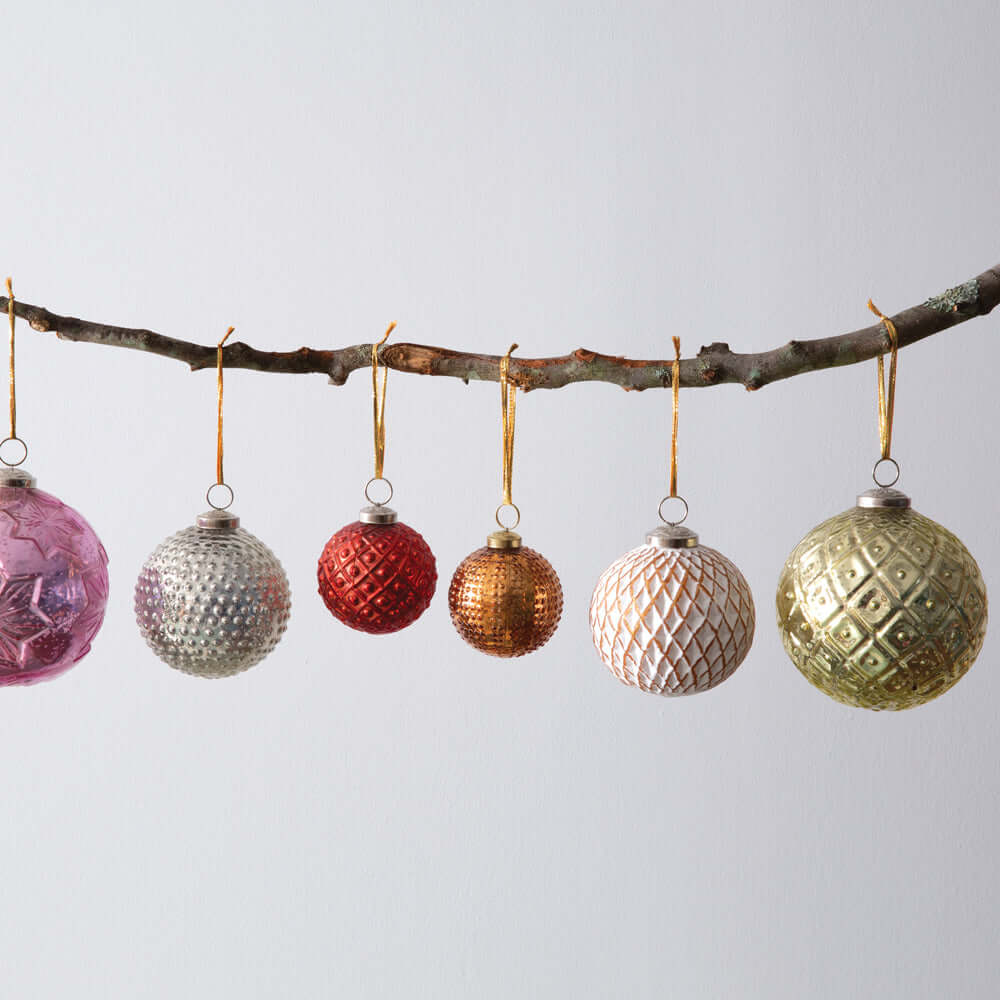 Vintage Gold Mercury Glass Christmas Ball Ornaments (Set of 4) displayed hanging from a branch, featuring a diamond pattern and elegant gold tie.