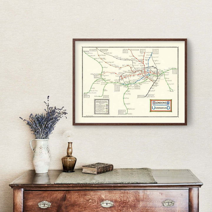 Framed Vintage London Underground Map 1922 on a wall, depicting historic railway routes as elegant wall art.