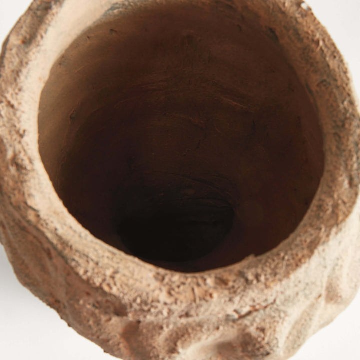 Interior view of a vintage moss terracotta male bust planter, showcasing its textured, rustic finish and deep cavity for planting.