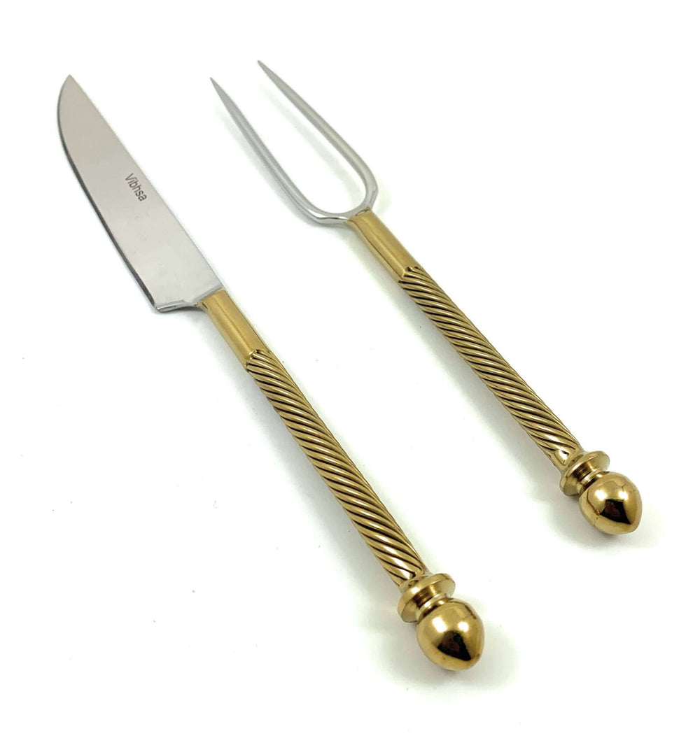 Vintage Stainless Steel Carving Set with Golden Handles featuring a knife and fork with ornate handles.