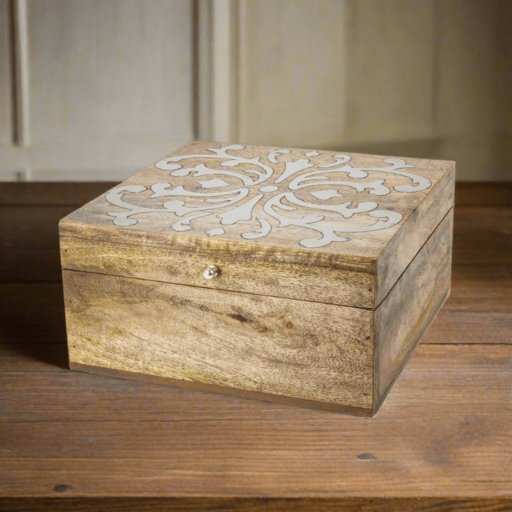 Vintage Wood Keepsake Storage Box with Lid featuring metal inlay design on lid, made of mango wood, resting on wooden surface.