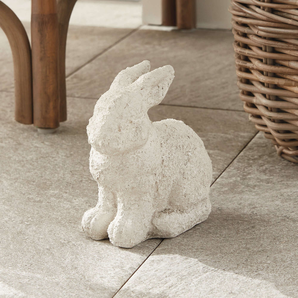 Weathered terracotta bunny garden statue, white finish, hand-sculpted, perfect for outdoor decor.