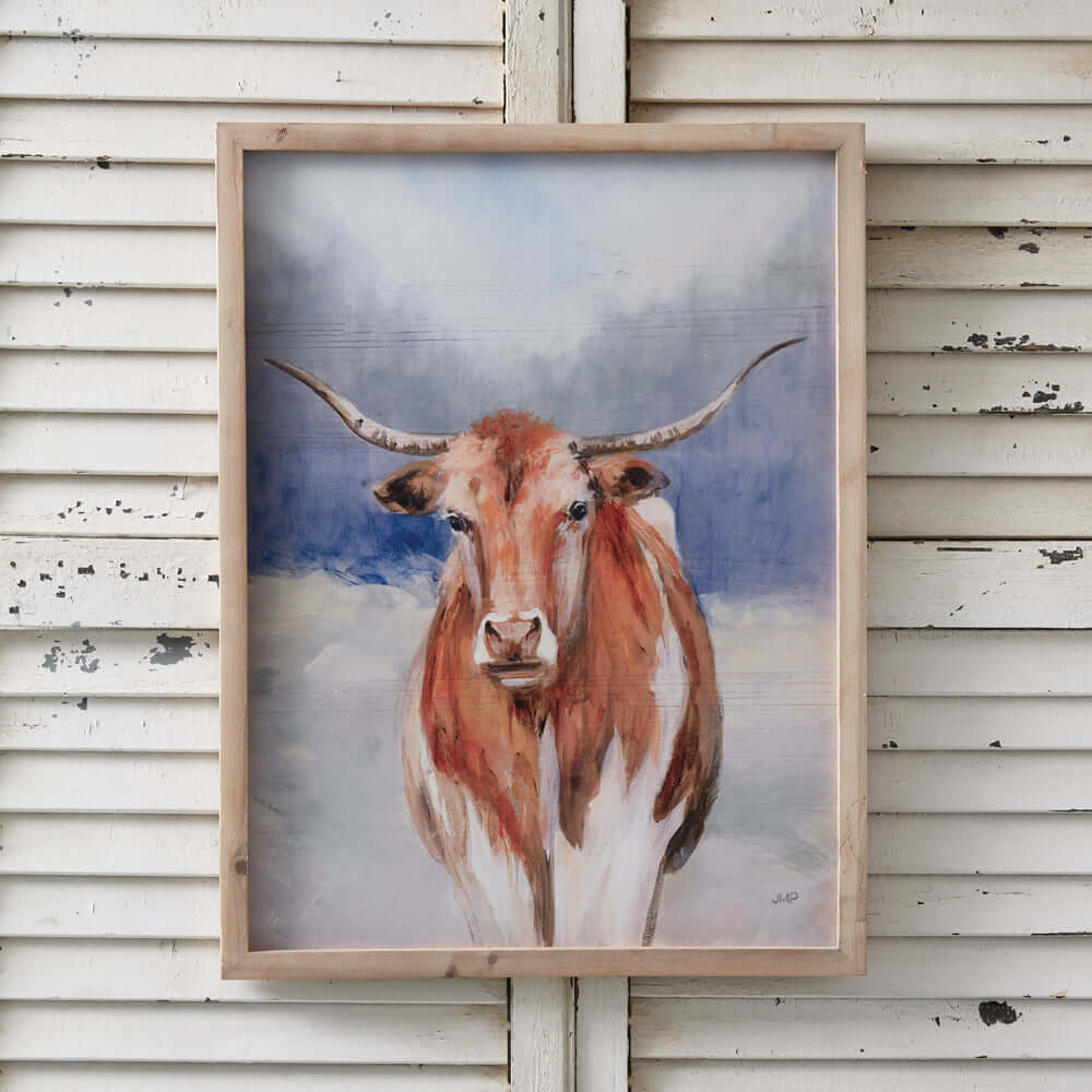 Framed Western Texas Longhorn wall art print featuring a picturesque Longhorn against a scenic backdrop, perfect for rustic decor.