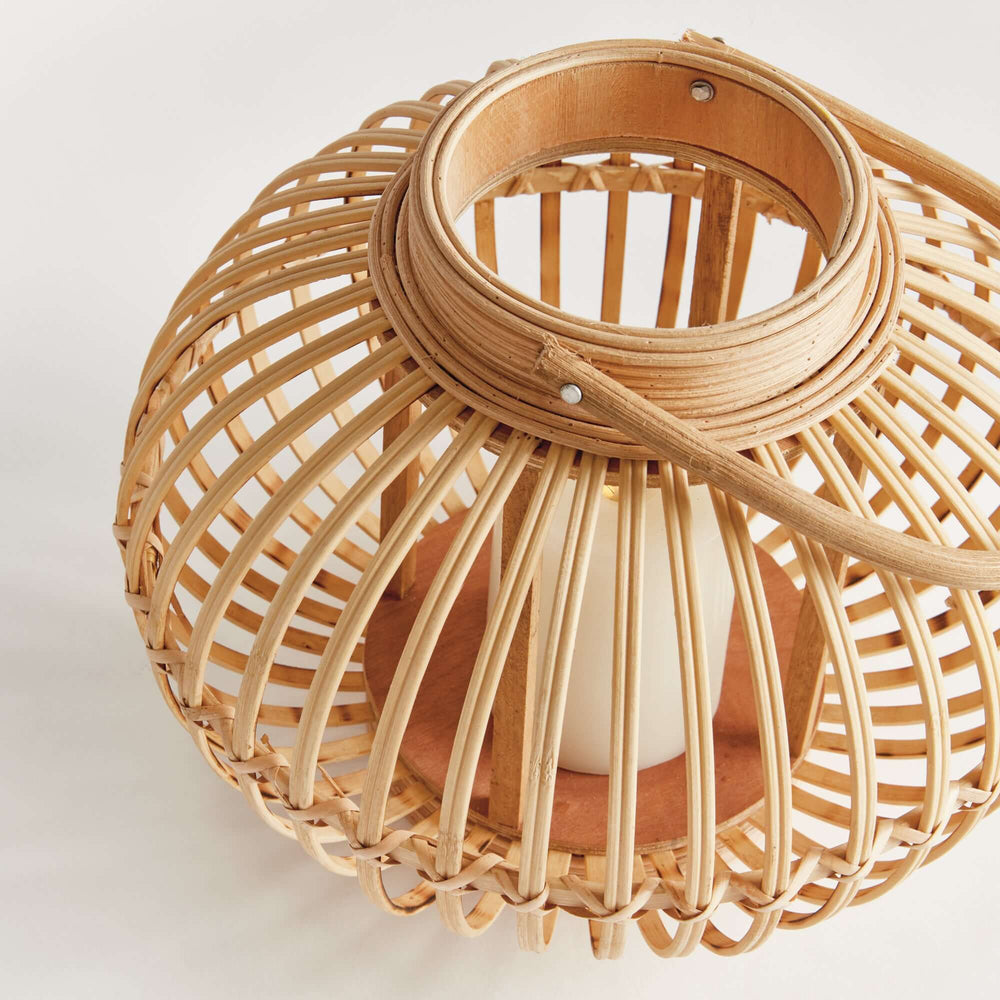 Woven rattan bamboo round candle lantern showcasing natural craftsmanship and elegant design.