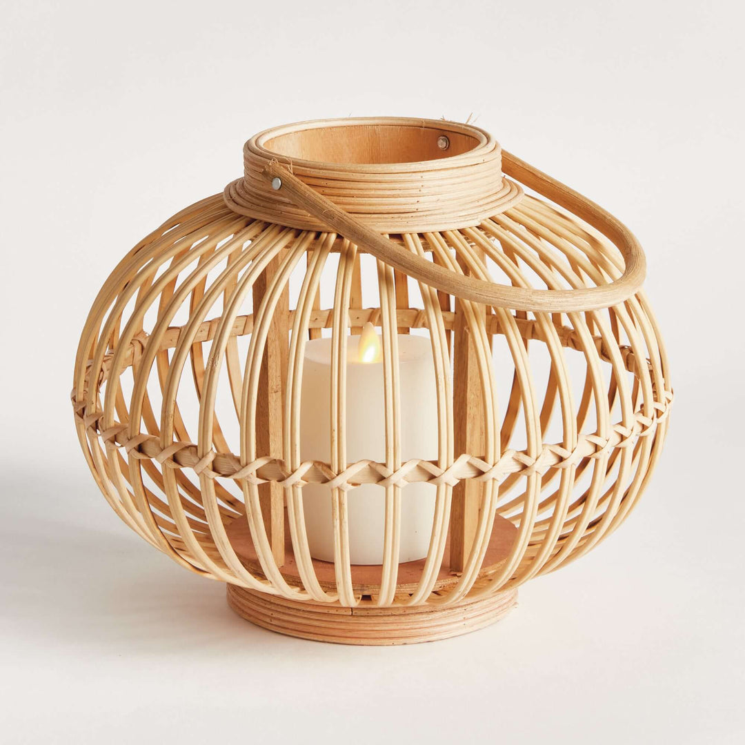 Woven rattan bamboo round candle lantern with globe shape, evoking elegant craftsmanship and natural beauty.
