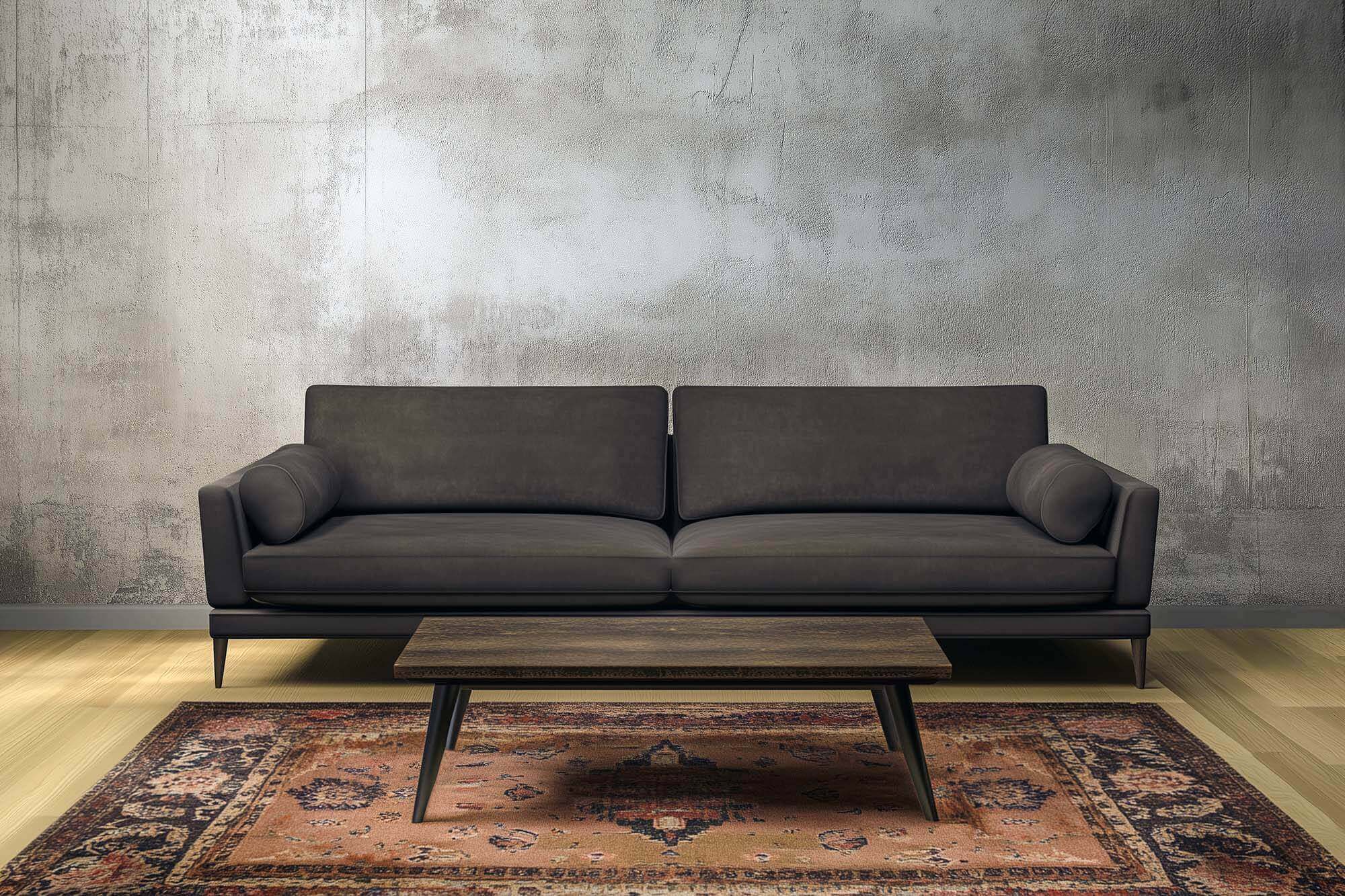 Modern black sofa with vintage rug in a stylish living room