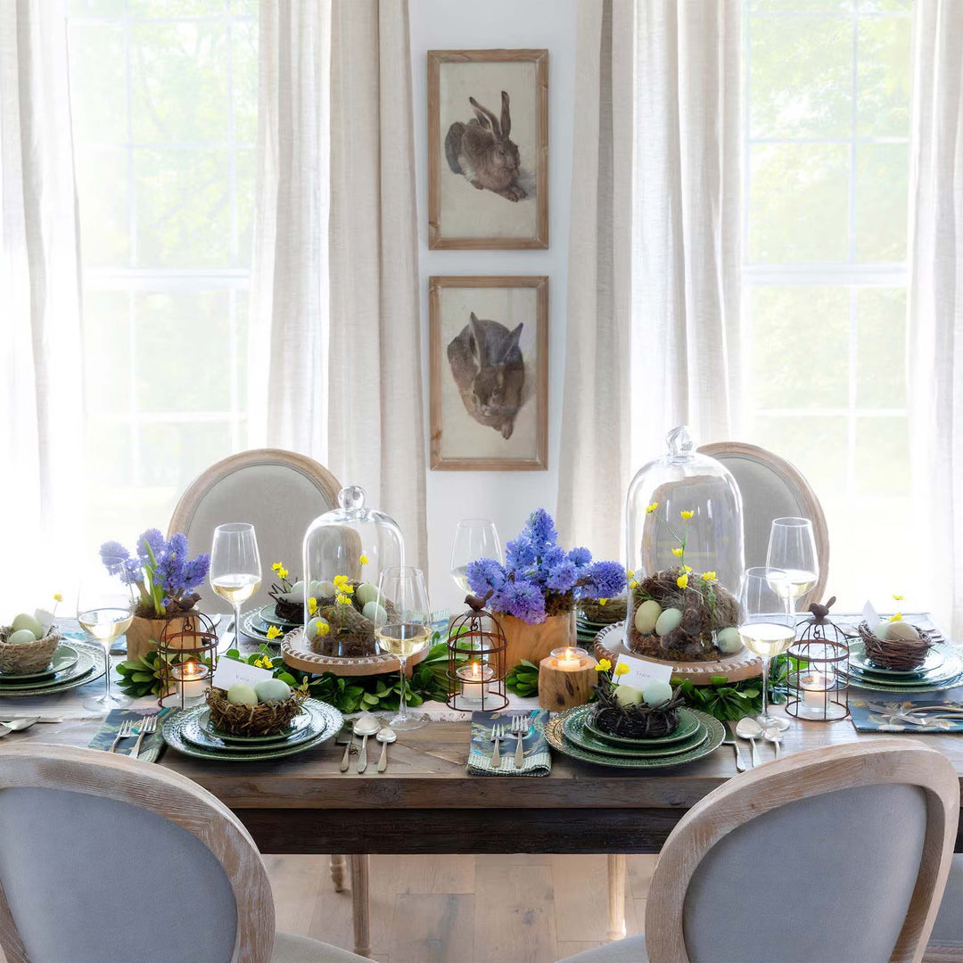 Elegant dining table setup with vintage gifts for hosts & hostesses, featuring floral decor and rustic charm.