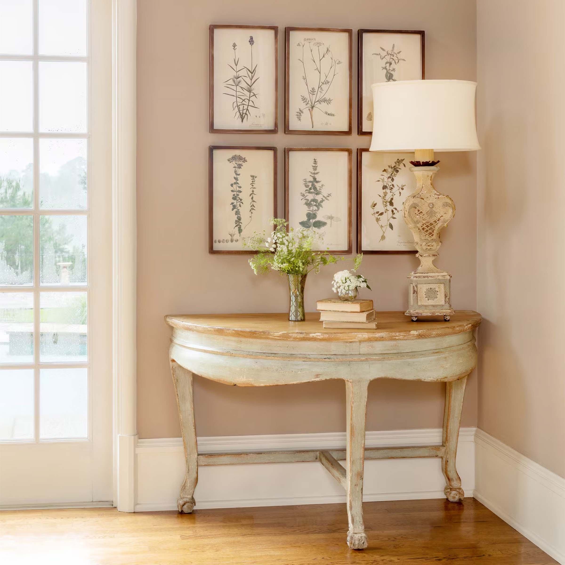 Vintage Gifts for Nature Lovers display with vintage table, lamp, and botanical prints.