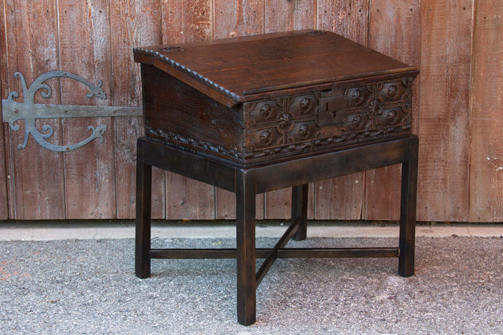 18th Century English Oak Writing Box on Stand showcasing Georgian craftsmanship against rustic wood backdrop.