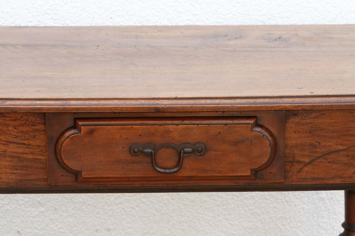 Close-up of a 19th Century French Walnut Antique Writing Table showcasing intricate craftsmanship and aged patina.