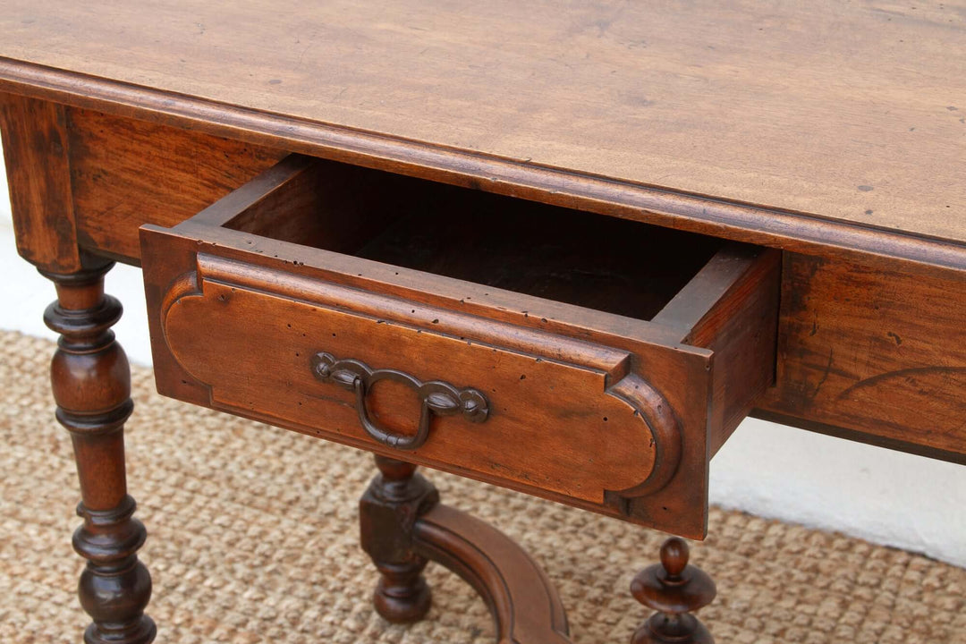 Close-up of 19th Century French Walnut Antique Writing Table with open drawer showing intricate craftsmanship.